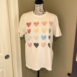 Women’s tshirt with multiple colored hearts. Perfect for on the go or at home